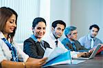 Businesswoman in a meeting with colleagues