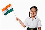 Schoolgirl holding an Indian flag
