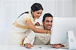 South Indian couple using a desktop computer