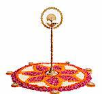 Oil lamps and rangoli of flowers at Onam