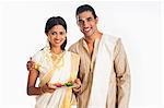 South Indian couple smiling at Onam