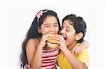 Children eating a burger