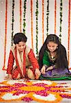 Children making rangoli on Diwali