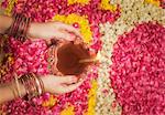 Woman holding an oil lamp on Diwali