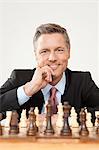 Businessman playing chess