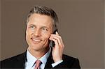 Smiling businessman on the phone