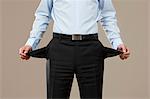 Businessman showing empty trouser pockets