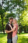 Happy young couple embracing outdoors