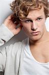 Pensive young man with curly hair