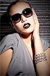 Young woman with lipstick and sunglasses