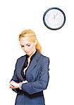 Blond businesswoman checking the time