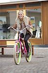 Happy woman riding bicycle