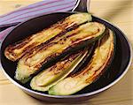 Browning the zucchinis in a frying pan