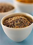 Small bowl of cumin seeds