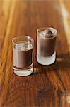 Small glasses of chocolate milk and chocolate ice cream