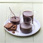 Cups of hot chocolate with cookies