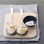 Spoonfuls of scallops with spices and lime