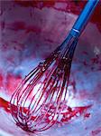 Whisk covered in sugar,fruit pulp and pectin