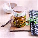 Jar of eggplants,thyme and garlic in oil