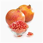 Whole pomegranate and pomegranate seeds