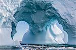 Huge arched iceberg near Petermann Island, western side of the Antarctic Peninsula, Southern Ocean, Polar Regions