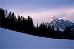 The last run, a view of Sassongher mountain at sunset from a piste at Alta Badia ski resort, Dolomites, South Tyrol, Italy, Europe