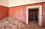 Interior of building slowly being consumed by the sands of the Namib Desert in the abandoned former German diamond mining town of Kolmanskop, Forbidden Diamond Area near Luderitz, Namibia, Africa