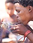 San (Bushman) demonstrating traditional fire lighting technique at the Okahandja Cultural Village, near Okahandja town, Namibia, Africa