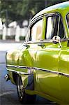 Green vintage American car parked on a street in Havana Centro, Havana, Cuba, West Indies, Central America