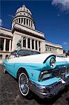 Blue vintage American car parked opposite The Capitolio, Havana Centro, Havana, Cuba, West Indies, Central America