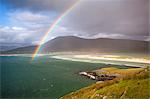 View across the beach at Seilebost towards Luskentyre and the hills of North Harris with a rainbow arching across the scene, Seilebost, Isle of Harris, Outer Hebrides, Scotland, United Kingdom, Europe