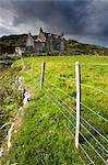 Abandoned croft beneath a stormy sky in the township of Manish on the east coast of The Isle of Harris, Outer Hebrides, Scotland