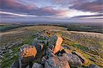 Early morning sunlight lights up the granite rocks of Belstone Tor, Dartmoor National Park, Devon, England, United Kingdom, Europe