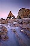 Blackchurch Rock and rocky ledges at twilight, Mouthmill Beach, North Devon, England, United Kingdom, Europe