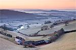 Frost coated countryside and farm buildings at sunrise, Exe Valley, Devon, England, United Kingdom, Europe