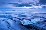 Ice and waves on Jokulsarlon Beach in winter, South Iceland, Polar Regions