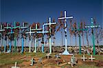 A series of tall crosses at the crest of the graveyard, boards represent doors to and from the grave, village of El Romerillo, Chiapas, Mexico, North America