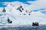 Tourists in a Zodiac in front of glaciers in Cierva Cove, Antarctica, Polar Regions