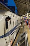 Train personnel looking out of the window of the Shinkanzen bullet train in the Shinkanzen train station in Tokyo, Japan, Asia