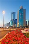 Contemporary architecture on Rashid Bin Saeed Al Maktoum Street at dusk, Abu Dhabi, United Arab Emirates, Middle East