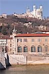 The waterfront in Old Lyon with the Basilica Notre Dame de Fourviere on the hill, Lyon, Rhone-Alpes, France, Europe