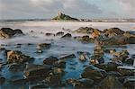 Rocky shoreline and St. Michaels Mount, early morning, Cornwall, England, United Kingdom, Europe