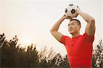 Athletic Man Throwing Soccer Ball