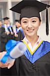 Young Female Graduate Holding Diploma