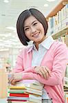 Portrait of Smiling Young Woman in Library