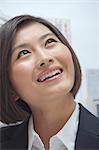 Portrait of Smiling Young Businesswoman, Looking up