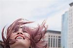 Young woman with hair blowing