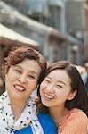 Portrait of mother and daughter on the street in Beijing, close up