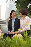 Young businesswomen working outdoors