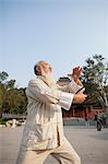 Senior Man Practicing Tai Ji